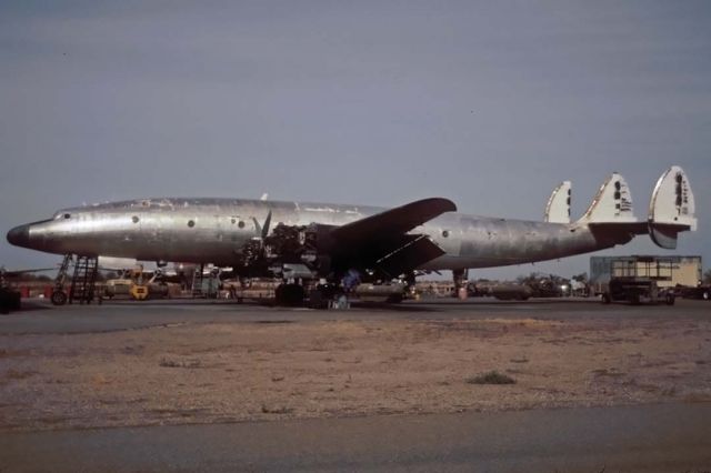 Lockheed EC-121 Constellation (N105CF) - Lockheed C-121G N105CF at Avra Valley, Arizona on November 23, 2001. Its Lockheed construction number is 4137. It was being restored for display by the Super Constellation Flyers group in Switzerland until they realized the true cost of its restoration. They abandoned their restoration effort and acquired the Camarillo Connie N73544. N105CF was eventually scrapped.br /br /It was delivered to the Navy as R7V-1, 131636. It was transferred to the Air Force as 54-4062, "City of Saratoga" in June 1958. It was later re-designated C-121G. The Air Force renamed it "City of Jackson Hole" in 1966 and retired it in May 1978. DMI Aviation bought it in November 1989 and registered it as N2114Z before selling it to Aero Chago in the Dominican Republic where it was registered HI-583CT in June 1990.