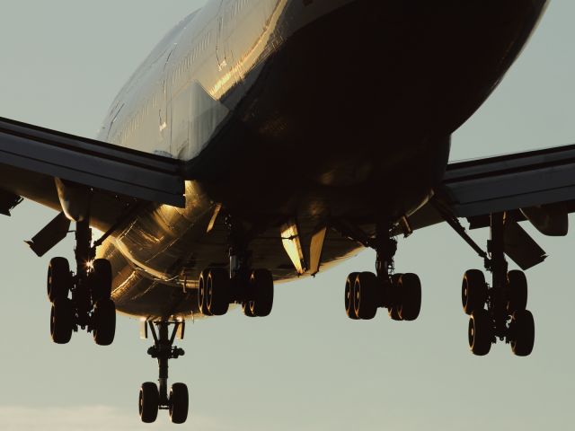 Boeing 747-200 (G-CIVT) - Main lainding gear in the frame at sunset.