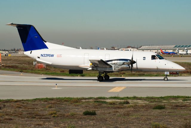 Embraer EMB-120 Brasilia (N229SW) - This former Skywest bird found a new home and is now flying for Berry Aviation after being converted to a freighter. Great to see it living on live instead of rotting away in the desert or being turned into soda cans.