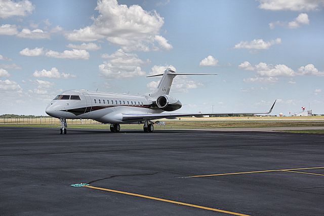 Bombardier Global Express (N311NB) - The temperature exceeded 101 degrees F on the ramp at Majors Field, Texas.  The aircraft stopped to deplane passengers for a ceremony.