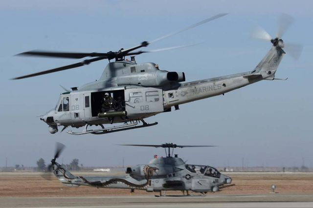 Bell UH-1V Iroquois (16-8499) - Bell-Boeing UH-1W Huey BuNo 168499 and AH-1W BuNo 165369 of HMLA-369 Gunfighters at NAF el Centro on February 19, 2015.