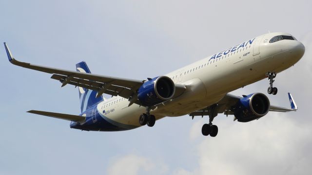 Airbus A321neo (SX-NAH) - An Aegean A321neo on final approach into LHR, landing on runway 09L.br /br /Location: Stanwell Moor Road, beside runway 09L.br /Date: 28.08.22 (dd/mm/yy)