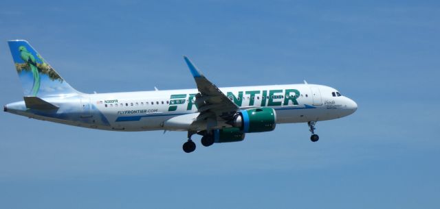 Airbus A320neo (N380FR) - On short final is this 2021 Frontier Airlines Airbus 320-251N with "Verde" the Resplendent Quetzal enjoying the tail view in the Summer of 2022.