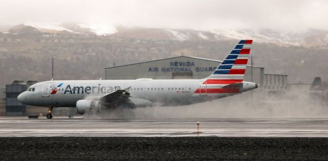 Airbus A321 (N119US) - The temp was just above freezing so it had been raining, but it stopped a few minutes before N119US touched down on 16R to finish a trip from Phoenix (KPHX).