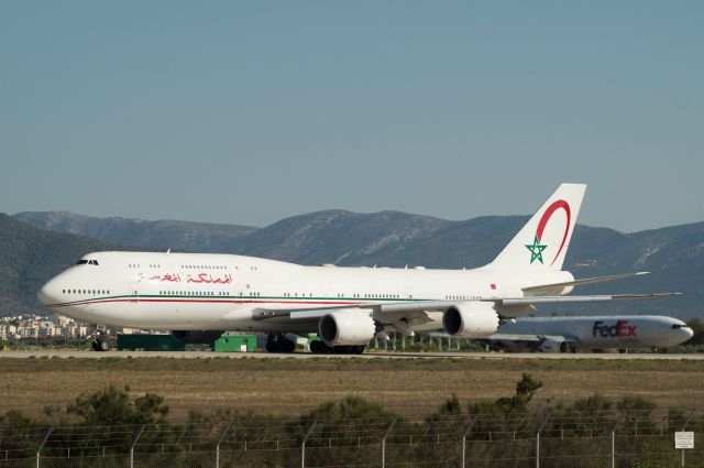 BOEING 747-8 (CN-MBH) - Royal Moroccan Air Force VIP flight getting ready to take off from runway 03L. Behind it, a FedEx MD11 waiting its turn. Very rare aircrafts in Athens.