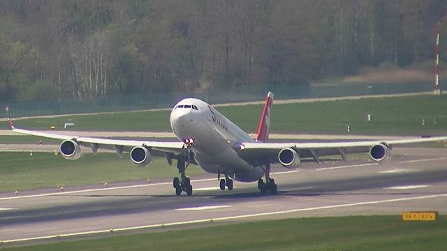 Airbus A340-300 (HB-JMI) - Departing for Shanghai. Close to a tail strike.