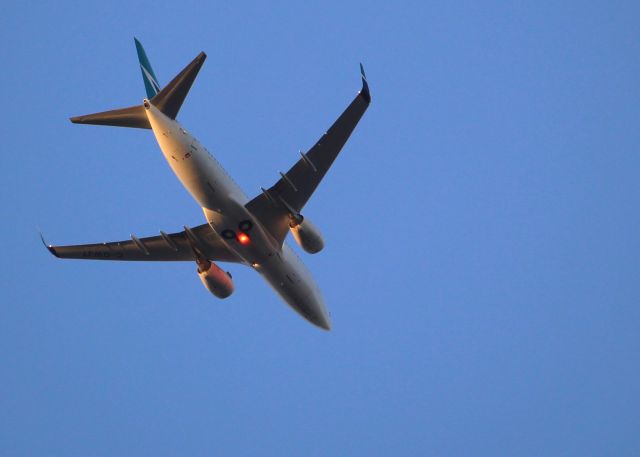 Boeing 737-700 (C-GWJT) - Underbelly shot taken at dusk from Sunnybrook Flats, Toronto