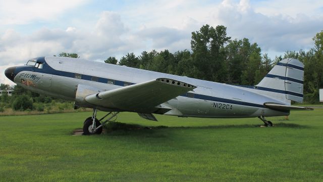 Douglas DC-3 (N122CA) - Seen at the closed Clinton County Airport on 14 August 2018.