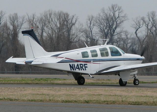 Beechcraft Bonanza (36) (N14RF) - Turning onto runway 14 at the Shreveport Downtown airport.