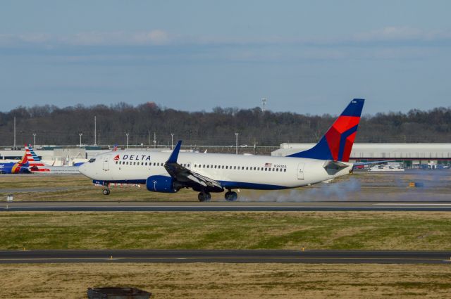 Boeing 737-900 (N393DA) - Delta 1592 is smoking a landing from Salt Lake City on Nashville's Runway 2L.  Photo taken March 18, 2019 at 5:46 PM with Nikon D3200.   