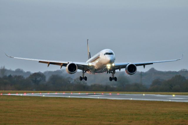 Airbus A350-900 (9V-SMO) - SIA52 catching the runway lights on arrival from Singapore on New Year's Eve.