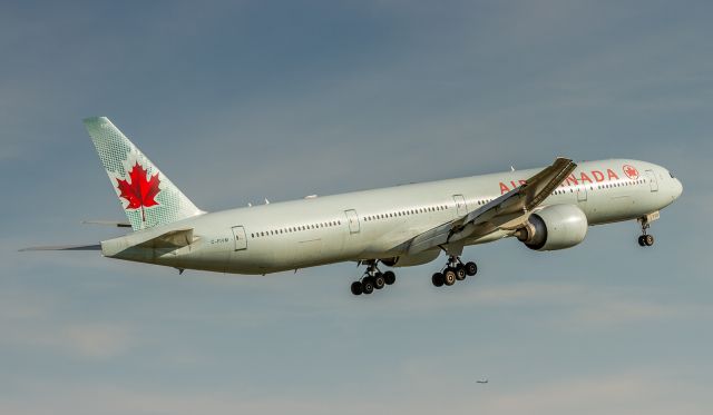 BOEING 777-300ER (C-FIVM) - ACA32 pulls up to go around as the preceding aircraft did not clear the runway in time