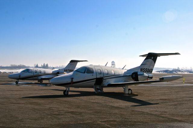 Eclipse 500 (N550AD) - TWO ECLIPSE EA500 AT LONDON, ONT., IN EARLY MORNING LIGHT WITH FROST ON THEM.