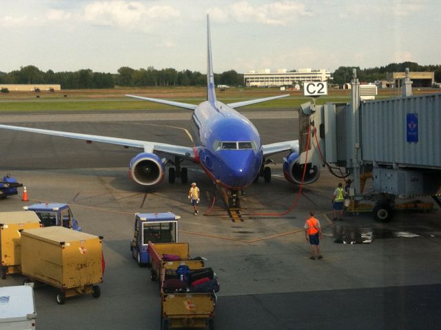 Boeing 737-700 (N222WN) - Came into gate C2 "Florida One" (N945WN) pushed back.