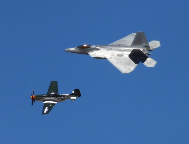 — — - P51 and F22 fky by at the National Air Races Reno, September 2012