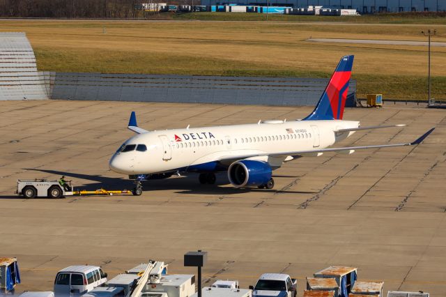 N114DU — - This is actually the first A220 ever to be in the delta hangar. Here it is being pushed back out of the hangar.