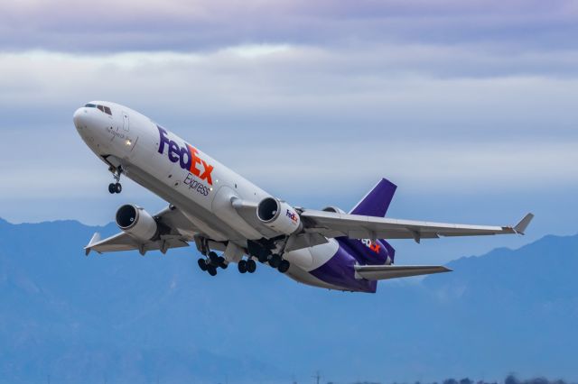 Boeing MD-11 (N606FE) - A FedEx MD11 taking off from PHX on 2/14/23. Taken with a Canon R7 and Canon EF 100-400 II L lens.