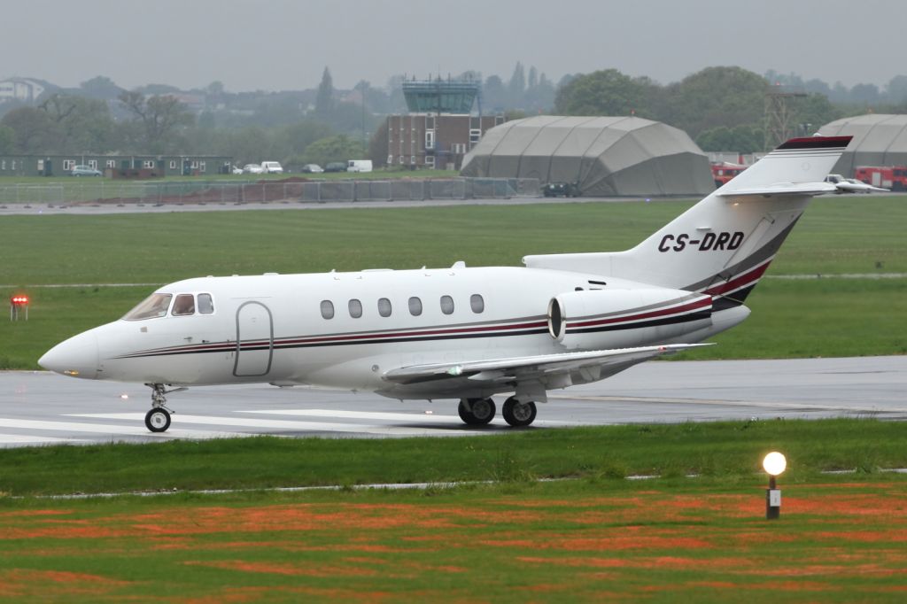 Raytheon Hawker 800 (CS-DRD) - Raytheon Hawker 800XP, lining up on RAF Northolts runway, on a very damp afternoon.