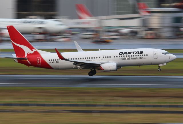 VH-VYK — - VYK Flares for touchdown on 16R.. Taken from the international carpark with a 70-200mm