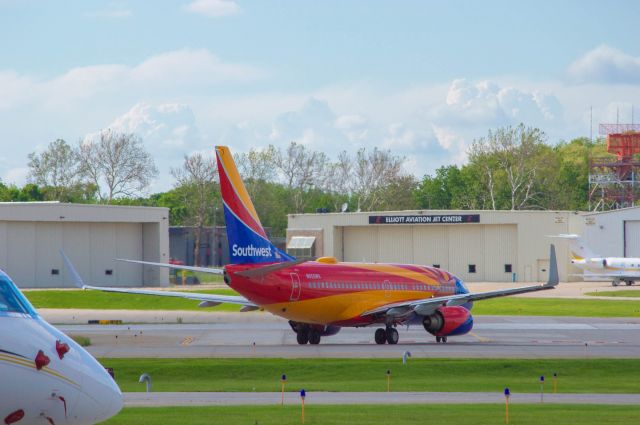 Boeing 737-700 (N955WN) - Southwest 755 is seen here holding short of DSM's Runway 23 for departure to St. Louis at 5:15 PM. This was a surprise catch as I was actually at the airport to pick someone up and had some time to planespot while I waited for them to arrive. The Arizona One colors look fantastic on the current livery -700.