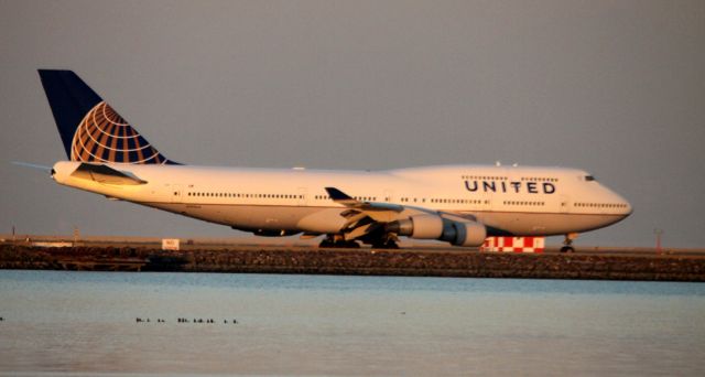 Boeing 747-200 (N199UA) - Taxiing to 28L for Takeoff. Operating as UA # 930 to LHR 01-31-2013