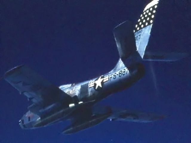 — — - "Belly shot" of 45th TRS jet over Northern Japan- 1956