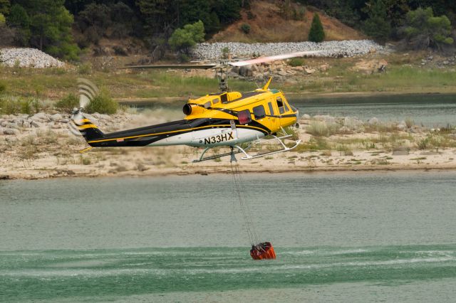 N33HX — - Bell 205A-1 retrieves water from nearby Bass Lake while battling Willow Fire in North Fork, CA. (2015)