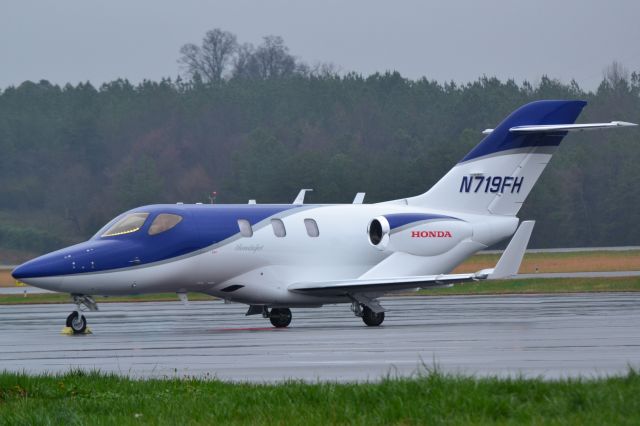 Honda HondaJet (N719FH) - 719FH LLC on a rainy day at JQF - 3/1/18