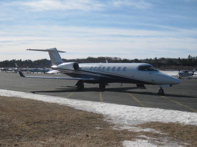 Learjet 45 (N438FX) - Parked in late February with some leftover snow from winter storm Nemo.