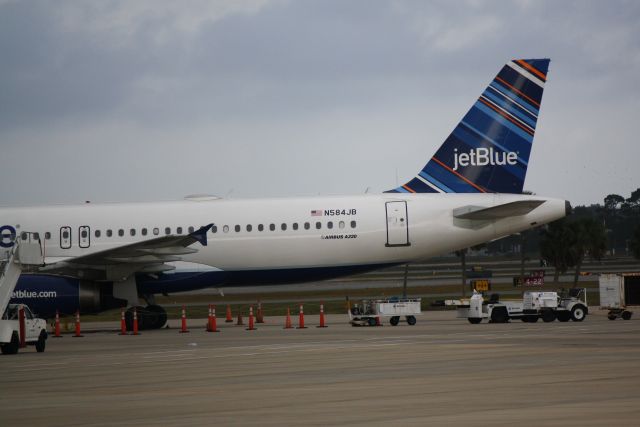 Airbus A320 (N584JB) - JetBlue Airbus A320 (N584JB) stranded at Sarasota-Bradenton International Airport following Winter Storm Hercules in the Northeast