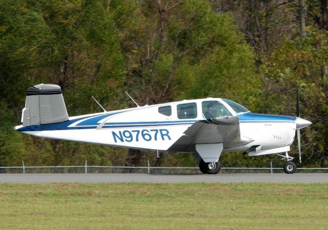 Beechcraft 35 Bonanza (N9767R) - 1959 Beech M35 rolling for take-off on 14 at Shreveport's Downtown Airport.