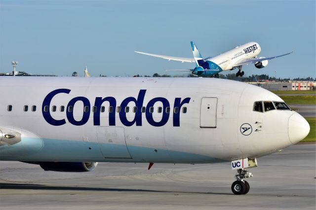 BOEING 767-300 (D-ABUC) - Condor Boeing 767-330(ER)(WL) arriving at YYC on July 12 with a Westjet Dreamliner departing in the background.