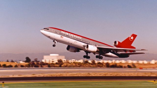 McDonnell Douglas DC-10 (N153US) - Just lifted off Runway 24L sometime in the early 90s