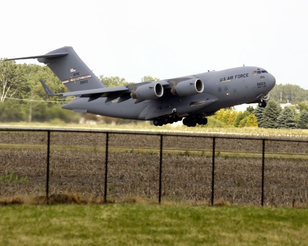 — — - C-17 Globemaster on climb-out from KDPA enroute to Washington D.C.