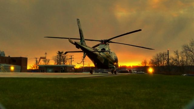 SABCA A-109 (N901XM) - N901XM (2020 Leonardo AW109SP, C/N 22422) rests at Central Maine Medical Center in Lewiston, Maine with a beautiful sunset behind the helicopter. This aircraft is in service with LifeFlight of Maine: Photo date: Sunday 11/28/2021 at 4:06 PM.