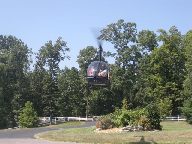 Robinson R-22 (N186SH) - Paul Salmon, CFII and Tim Brumitt- student , on approach to Tims driveway