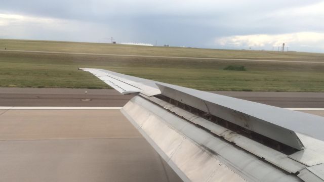 McDonnell Douglas MD-90 — - Landing rollout in KDEN, seat 33A