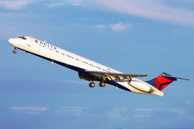 McDonnell Douglas MD-88 (N955DL) - 30L departure at sunset.