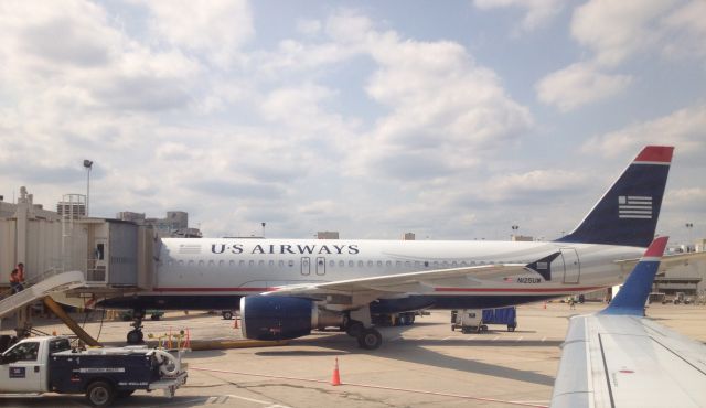 Airbus A320 (N125UW) - A US Airways Airbus A320 N125UW at Philadelphia International Airport (KPHL) on July 21, 2014. This picture was from a US Airways Express Embraer E170 N120HQ.