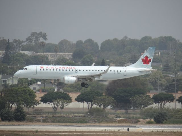 Embraer ERJ-190 (C-FHCI) - LAX on a very cloudy morning.