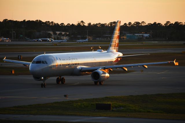 Airbus A321 (N519UW) - American Airlines operating an unusual aircraft for KDAB, taking the last of the race fans home a few days after the Daytona 500.