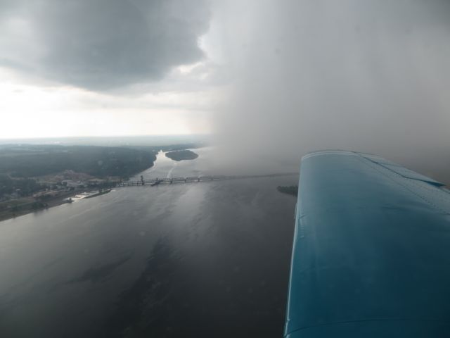 Mooney M-20 (N6859N) - Skirting rain showers over the Mississippi River on final to Fort Madison.