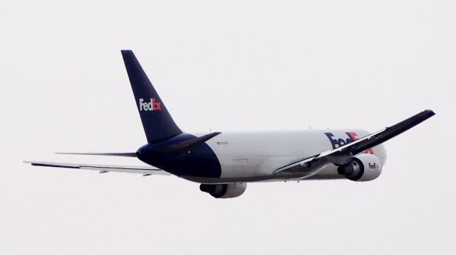 BOEING 767-300 (N104FE) - Departing from 36L.  