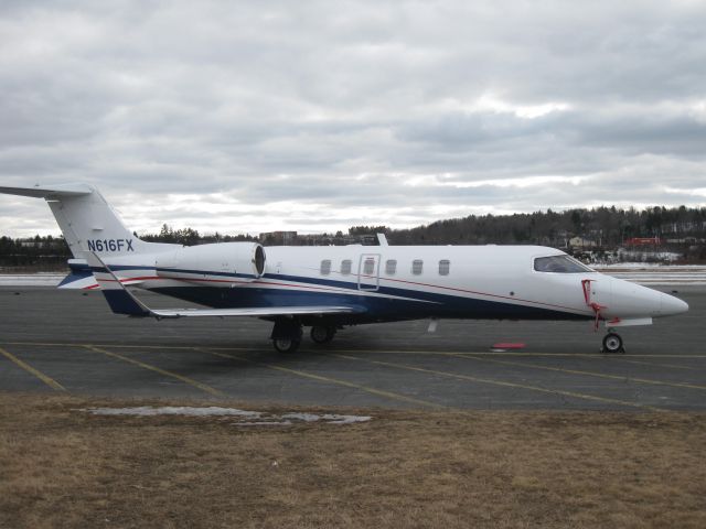 Learjet 40 (N616FX) - A nice-looking Lear sitting under a gray sky.