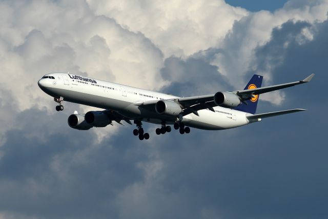 Airbus A340-600 (D-AIHR) - DLH 422 arriving from Frankfurt as storm clouds pass to the South