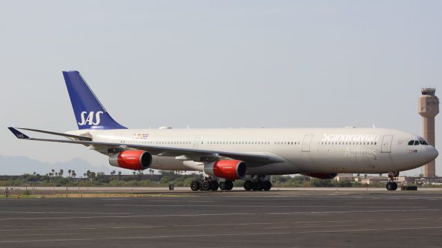 Airbus A340-300 (OY-KBI) - In at KTUS for customs