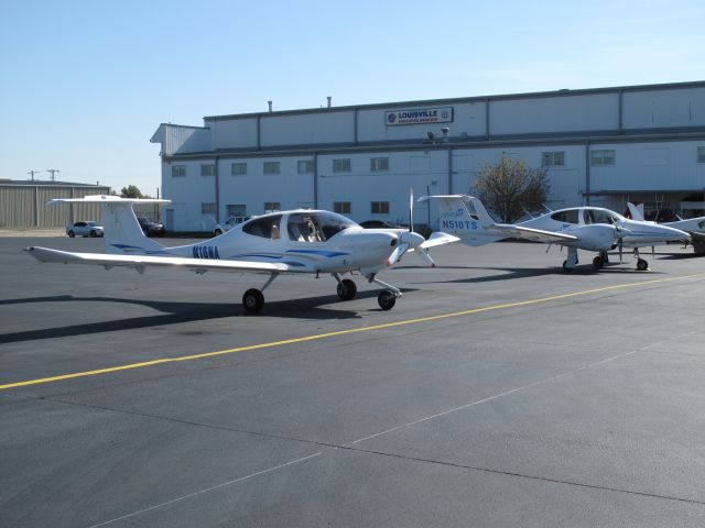 Diamond Star (N333WF) - A Diamond Star DA-40 (N16NA) parked next to its big brother, a Diamond Twin Star DA-42 (N510TS), on the Louisville Executive Aviation ramp at Bowman Field, Louisville, Kentucky.