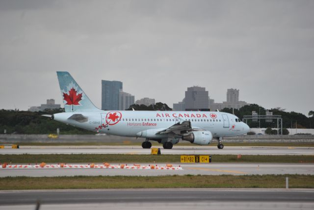 Airbus A319 (C-GBHZ) - Kids Horizons - Air Canada with City of Ft Lauderdale, FL in background