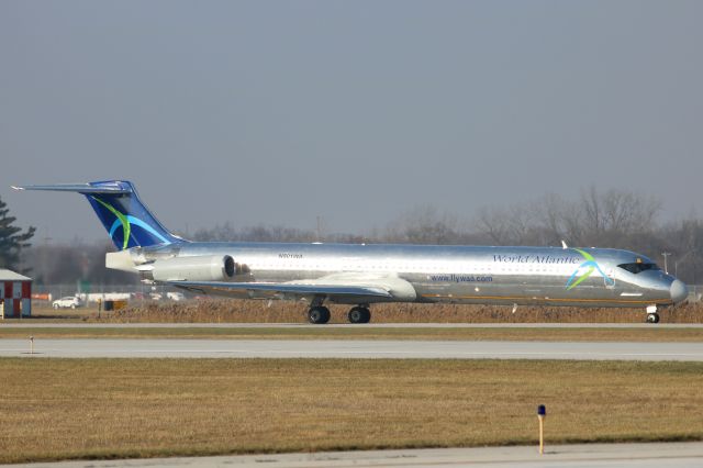 McDonnell Douglas MD-83 (N801WA) - The taxiway centerline can be seen in the reflection of this former American Airlines MD83 now wearing World Atlantic colors as it taxies to RWY 25 at KTOL on 11 Dec 2018. While barely visible, Luis Oliva is painted on the nose.