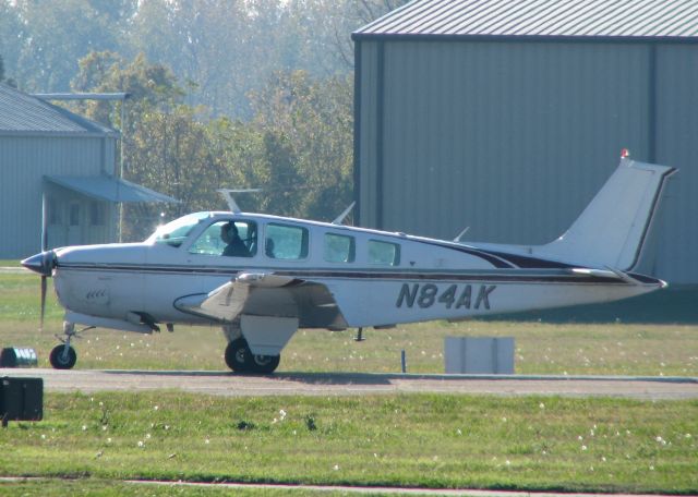 Beechcraft 35 Bonanza (N84AK) - Taking off on runway 5 at Downtown Shreveport.